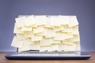 Coloured post-it notes covering laptop screen